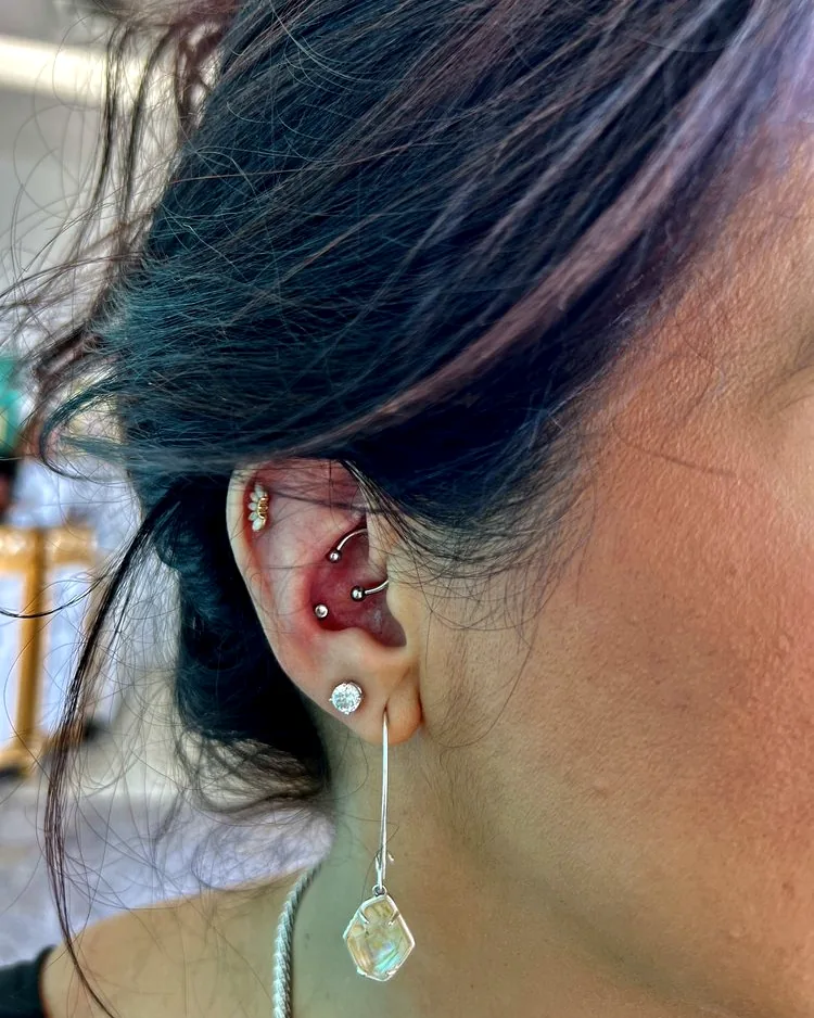 A curated ear — conch and rook placements with a lobe stud